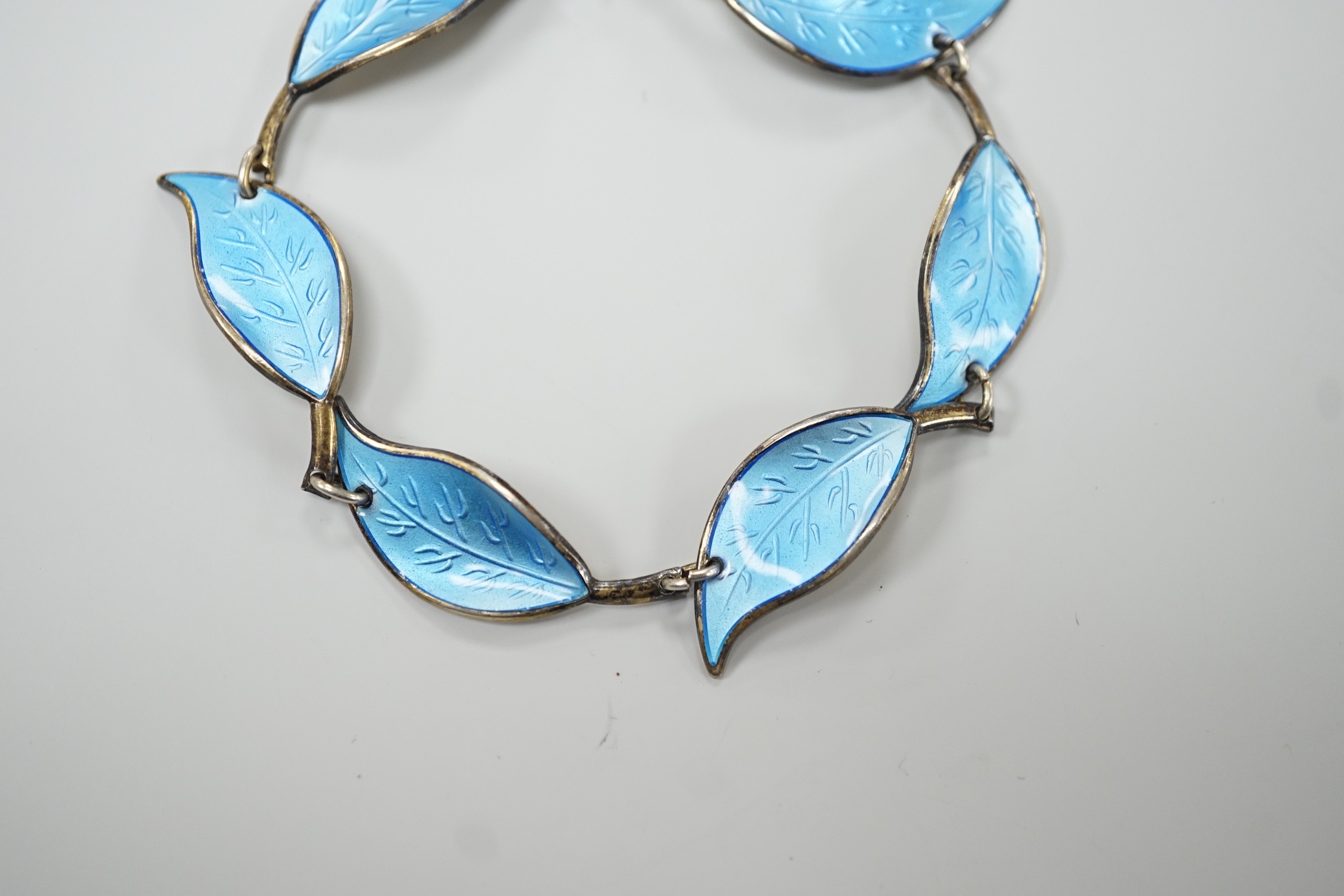 A 20th century Norwegian 925 sterling and blue enamel set leaf bracelet, by David Andersen, 16.5cm.